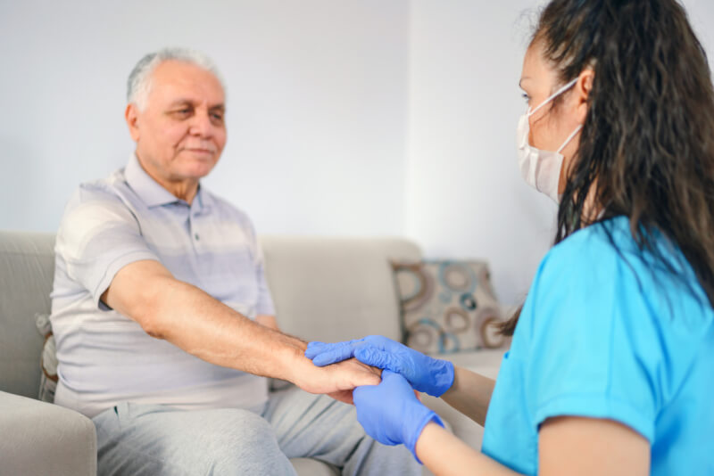 holding patient's hand for health care trust and support